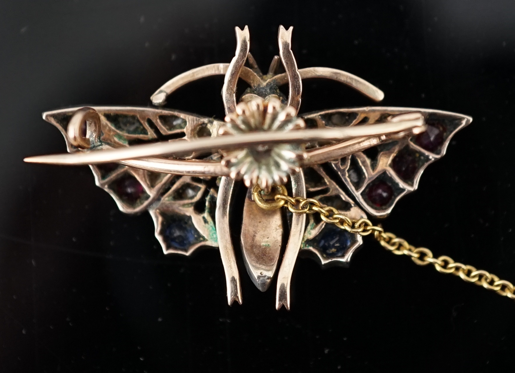 A Victorian gold, ruby, sapphire, split pearl and diamond cluster set butterfly brooch